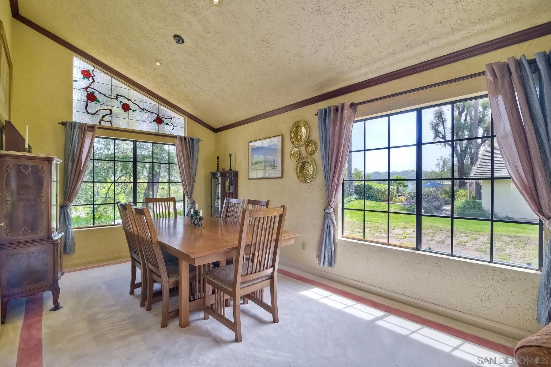 14859 Derringer Road Poway, CA 92064 - Photo 8 of 39 a view of a dining room with furniture a chandelier and wooden floor