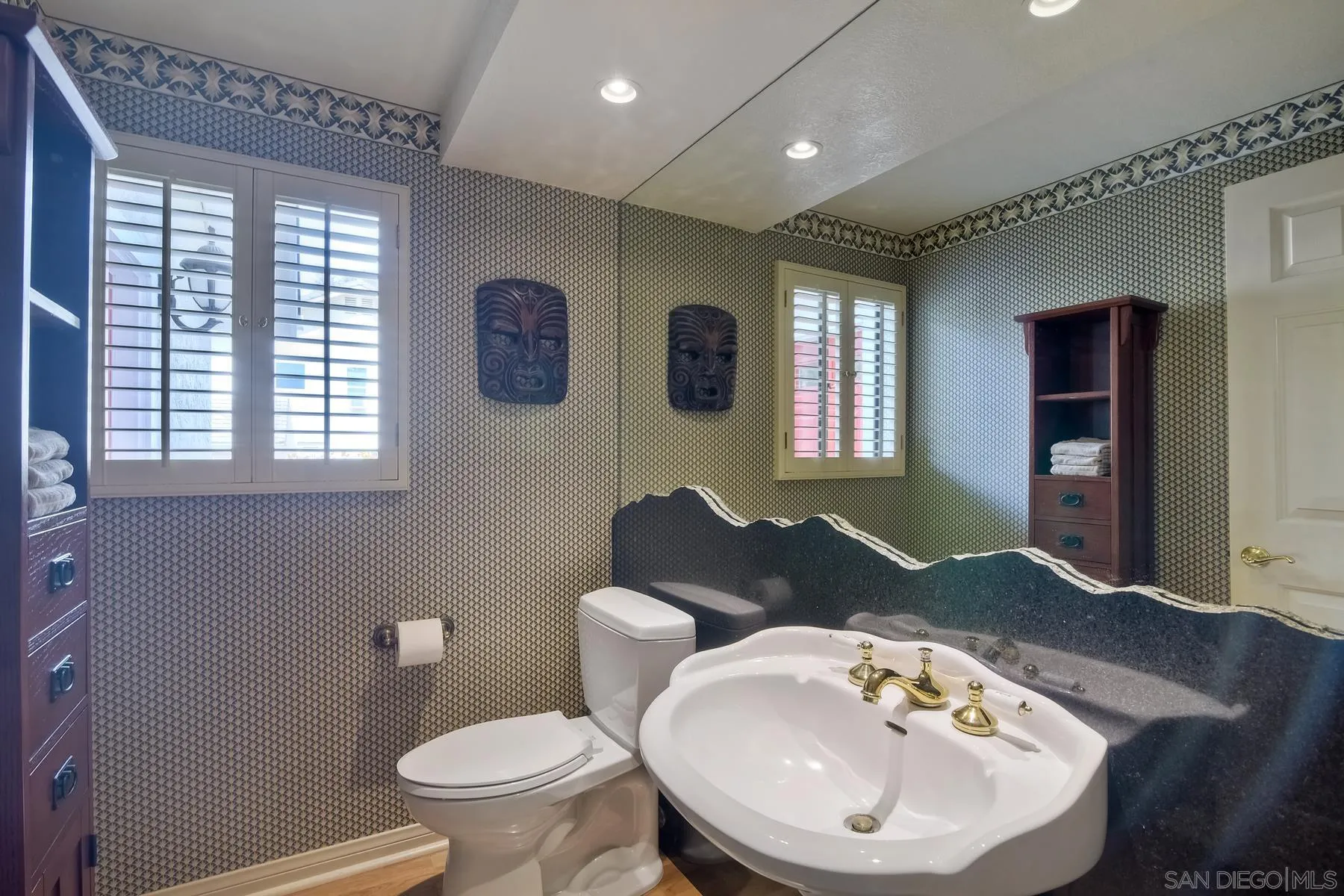 14859 Derringer Road Poway, CA 92064 - Photo 9 of 39 a bathroom with a toilet sink and mirror