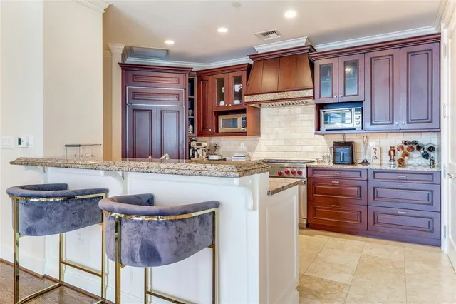a kitchen with a sink cabinets and window