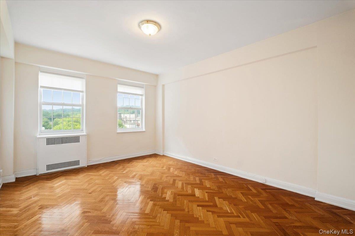 45 Popham Road, Unit 4J Scarsdale, NY 10583 - Photo 17 of 28 an empty room with windows