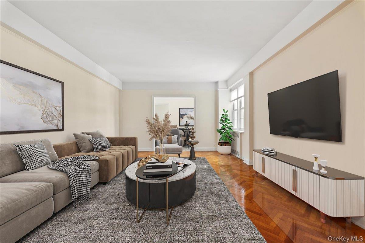 45 Popham Road, Unit 4J Scarsdale, NY 10583 - Photo 2 of 28 a living room with furniture and a flat screen tv