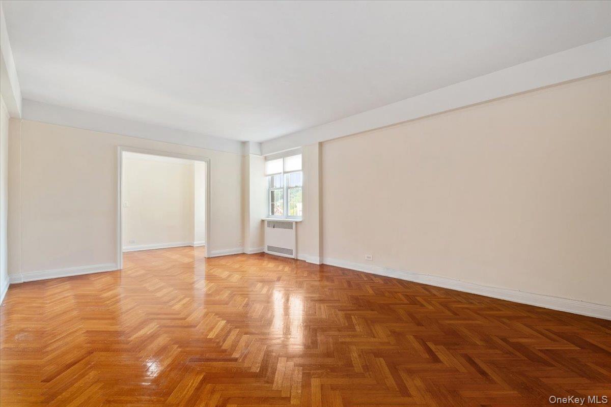 45 Popham Road, Unit 4J Scarsdale, NY 10583 - Photo 5 of 28 a view of an empty room and window