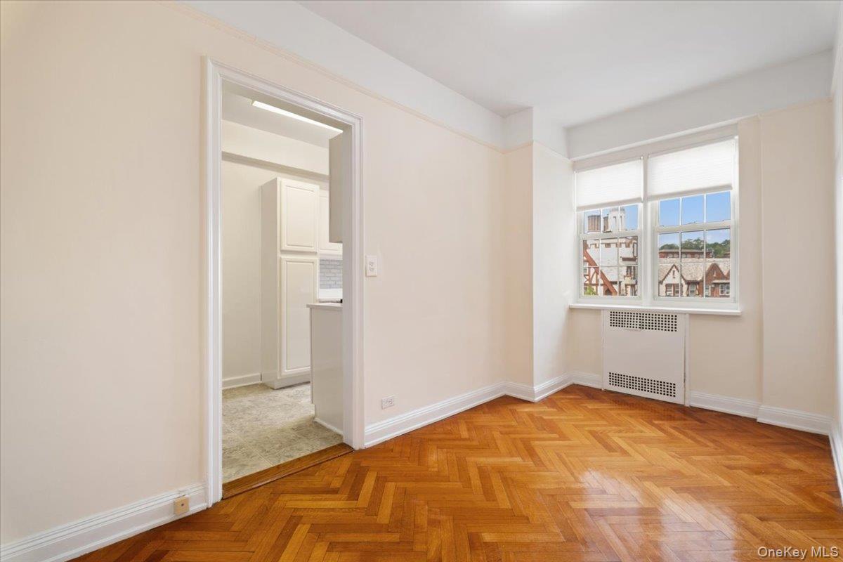 45 Popham Road, Unit 4J Scarsdale, NY 10583 - Photo 7 of 28 a view of a room with wooden floor and window