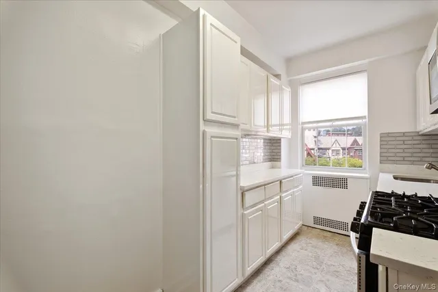 a kitchen with a sink stove and refrigerator