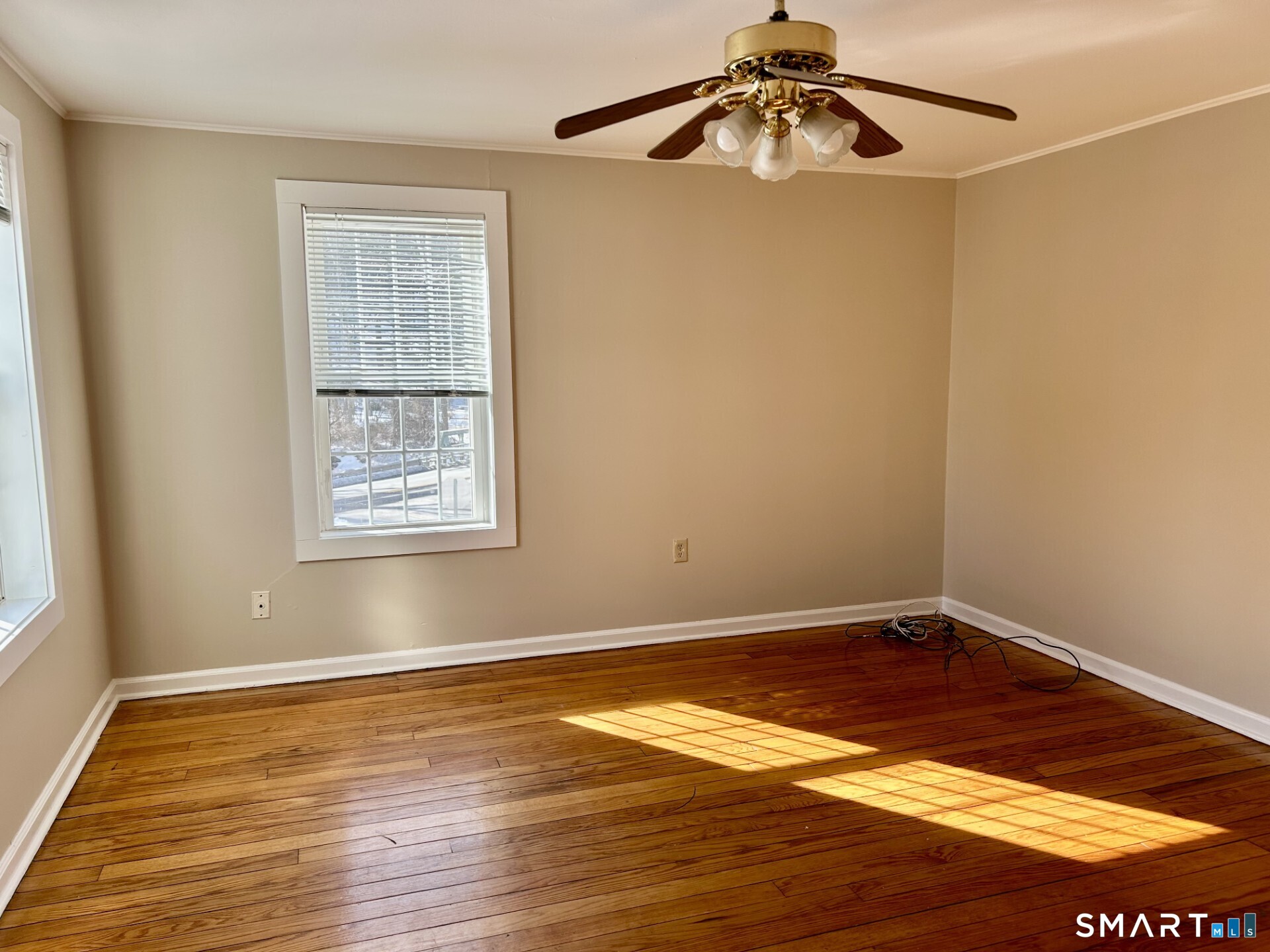 4 Weekeepeemee Road Woodbury, CT 06798 - Photo 12 of 18 a view of an empty room with wooden floor and a window