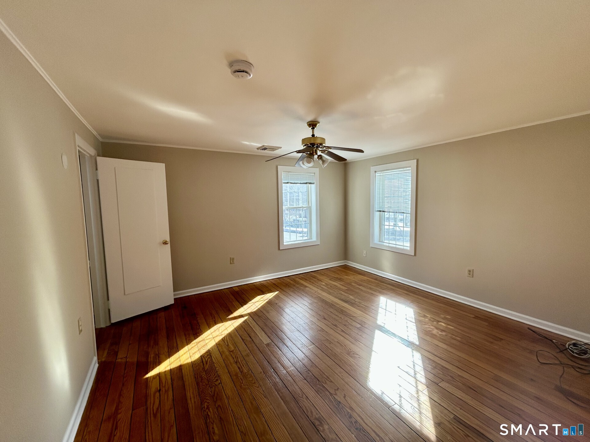 4 Weekeepeemee Road Woodbury, CT 06798 - Photo 9 of 18 a view of an empty room with wooden floor and a window