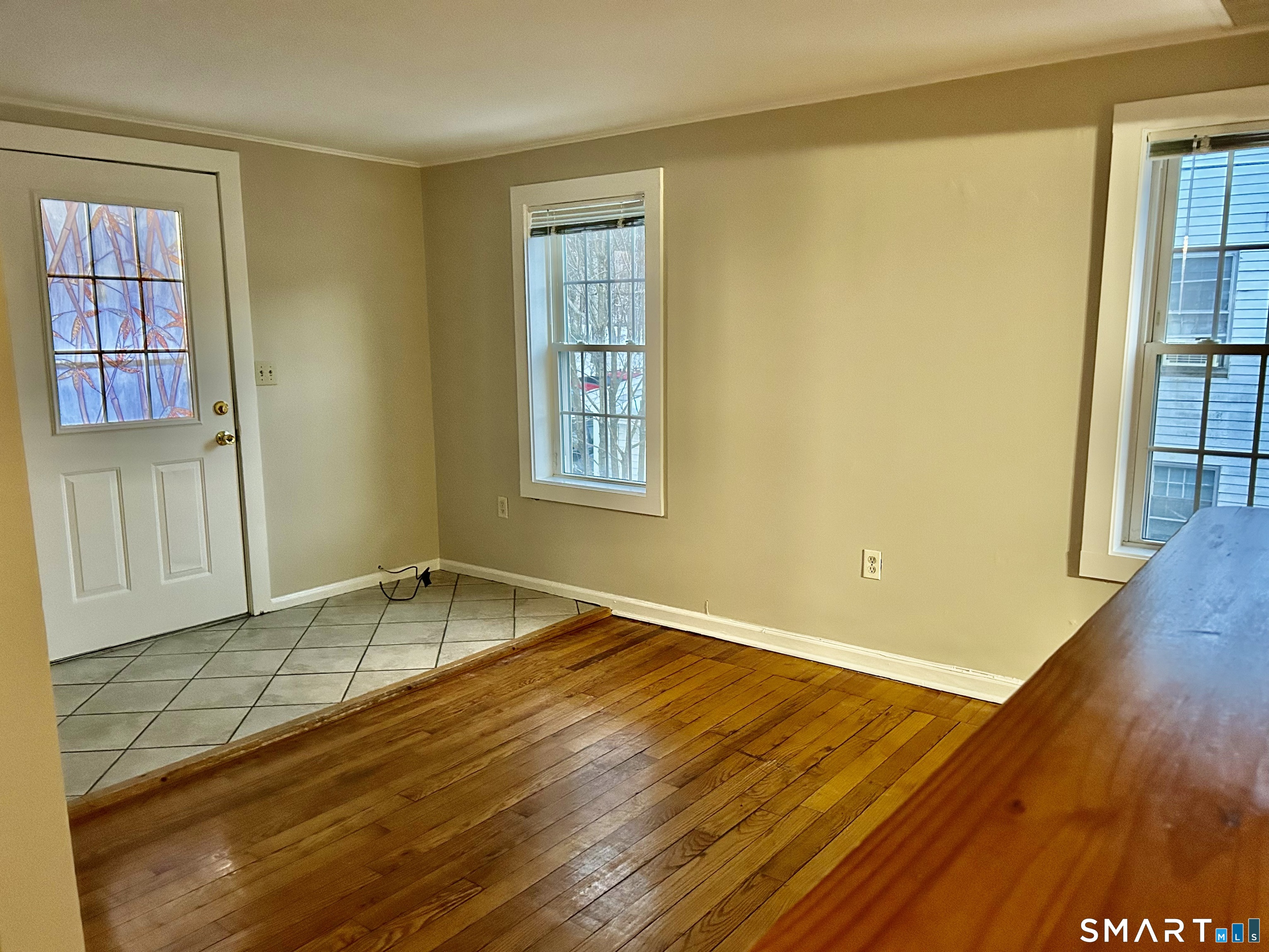 4 Weekeepeemee Road Woodbury, CT 06798 - Photo 10 of 18 a view of an empty room with wooden floor and a window