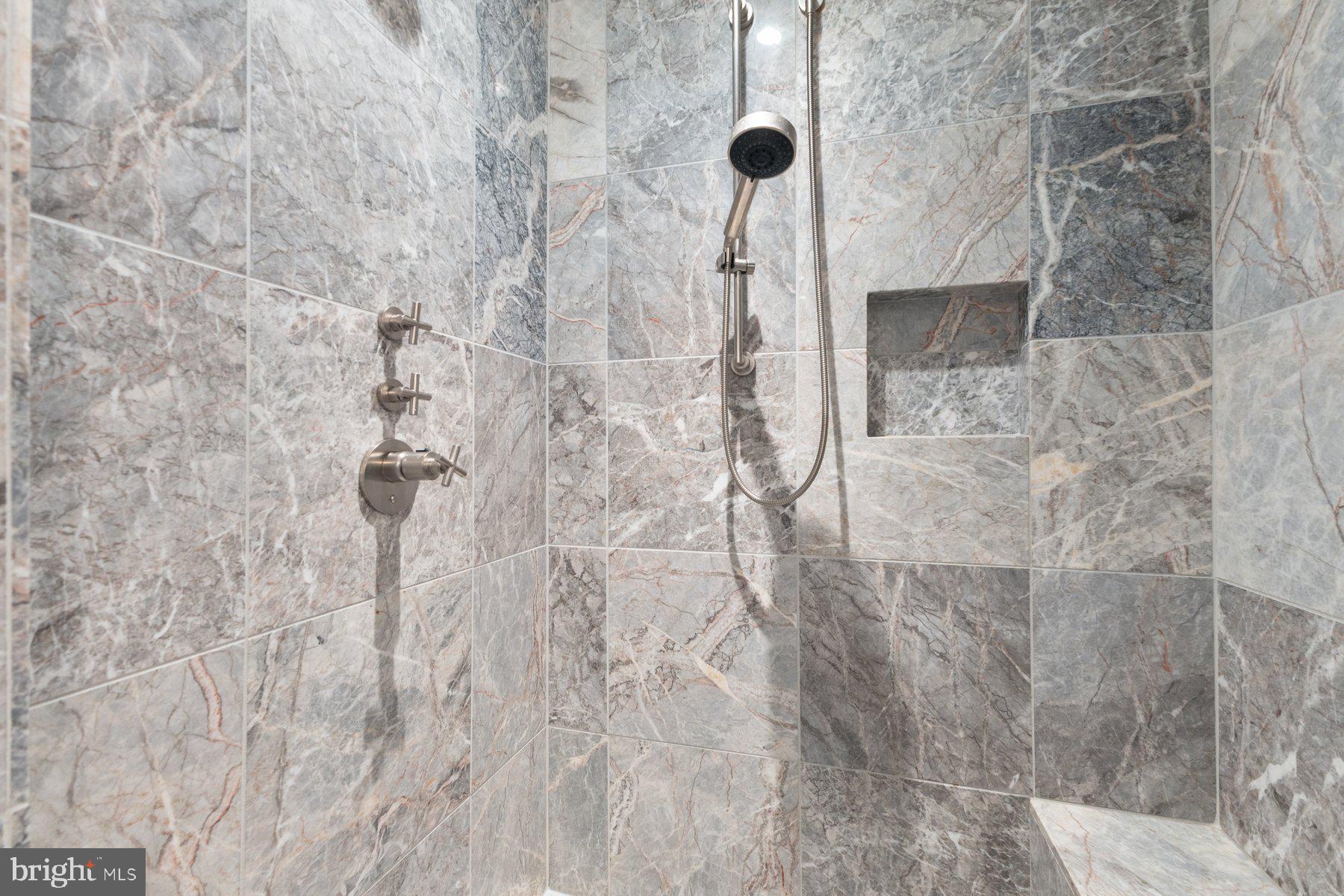 1881 North Nash Street, Unit 408 Arlington, VA 22209 - Photo 24 of 44 a bathroom with a shower