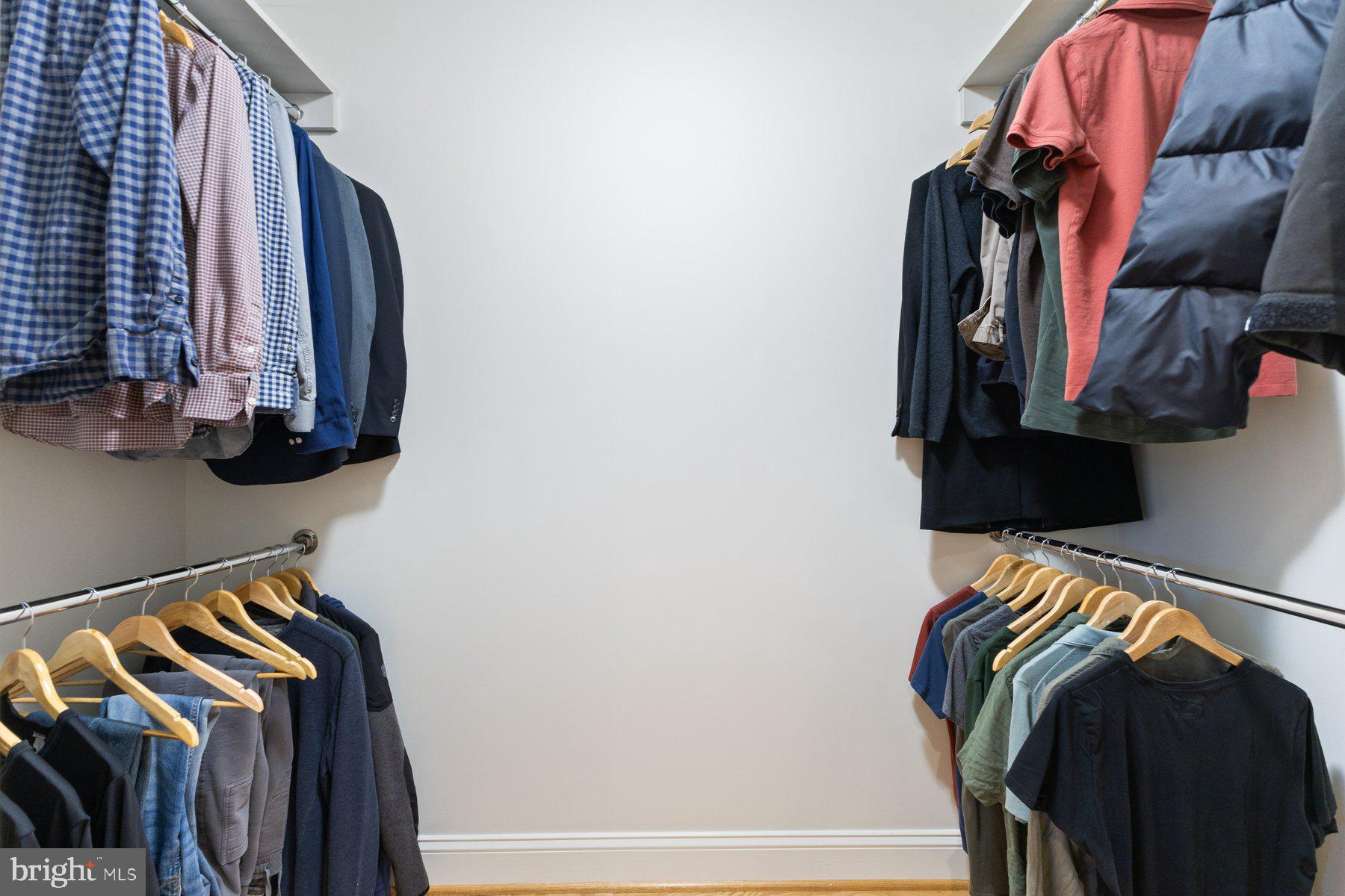 1881 North Nash Street, Unit 408 Arlington, VA 22209 - Photo 25 of 44 a view of walk in closet with clothes and shoes
