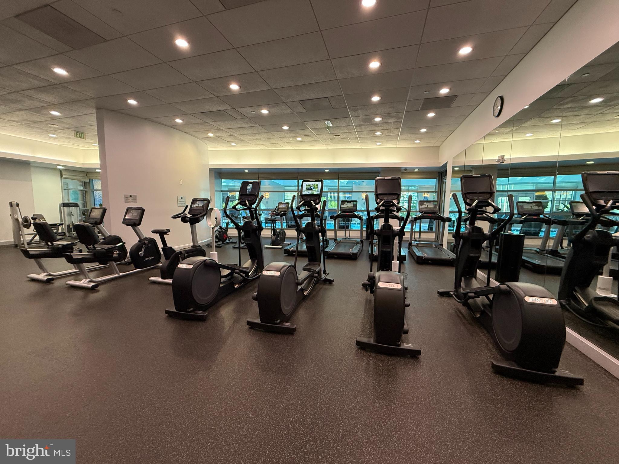1881 North Nash Street, Unit 408 Arlington, VA 22209 - Photo 42 of 44 a gym room with lots of gym equipment