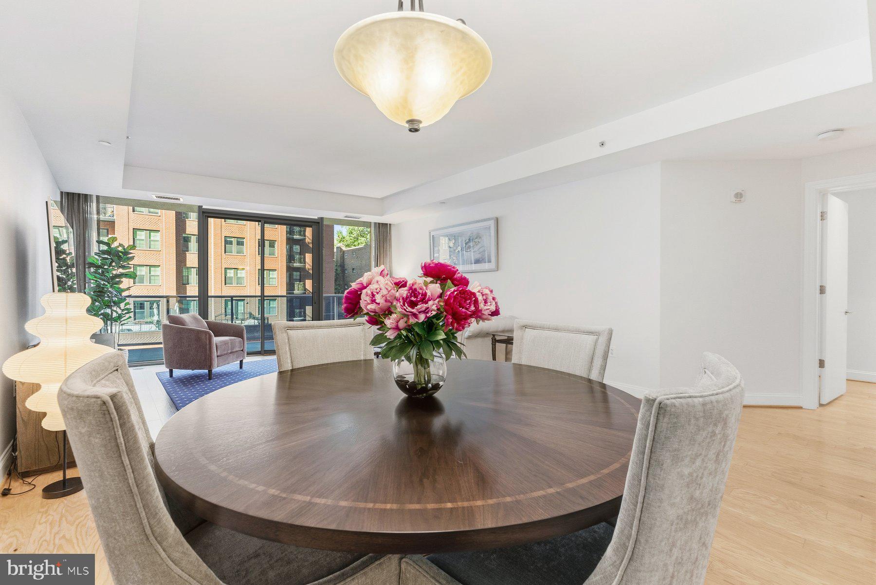 1881 North Nash Street, Unit 408 Arlington, VA 22209 - Photo 10 of 44 a dining room with furniture and wooden floor
