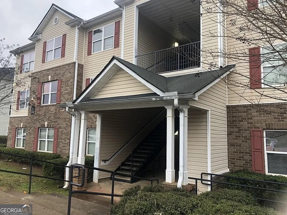 a front view of a house with stairs