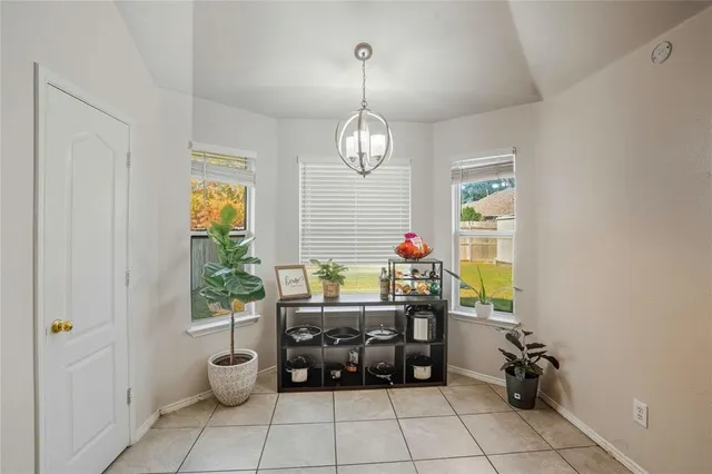a room with furniture and a flat screen tv