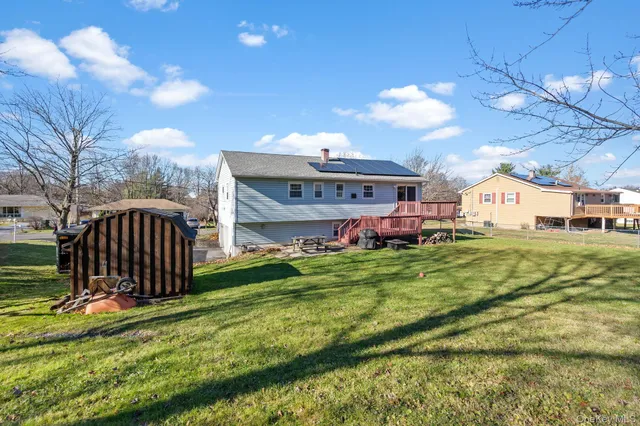 a view of a big room with table and chairs