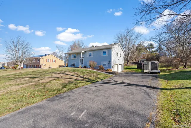 a view of a house with a big yard