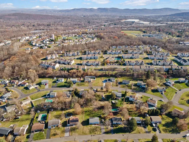 an aerial view of residential houses with outdoor space