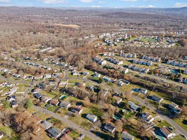 an aerial view of residential houses with outdoor space