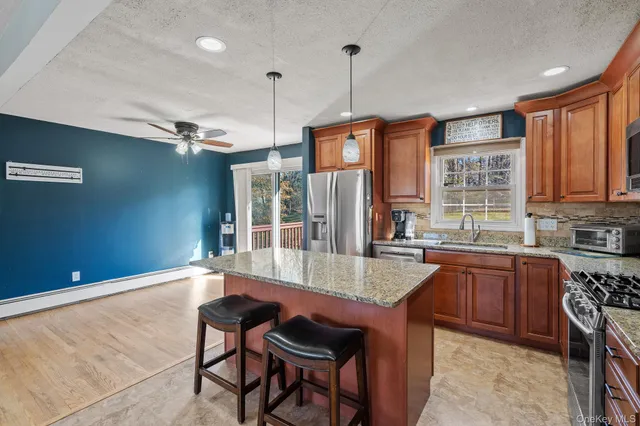 a very nice looking kitchen with a large window