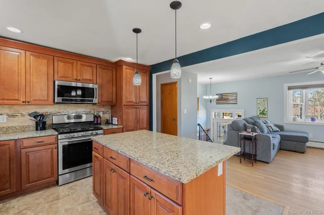 a kitchen with a counter top space and wooden floor