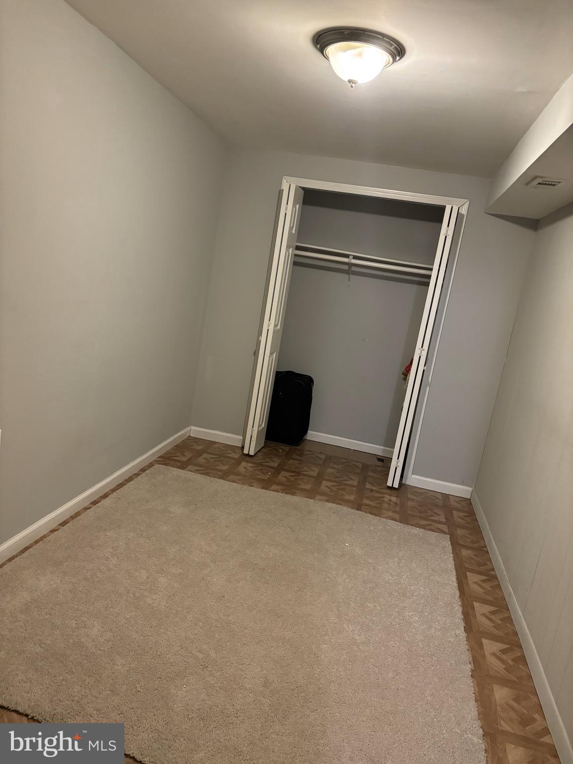 1404 Morningside Drive Silver Spring, MD 20904 - Photo 4 of 12 an empty room with wooden floor and a window