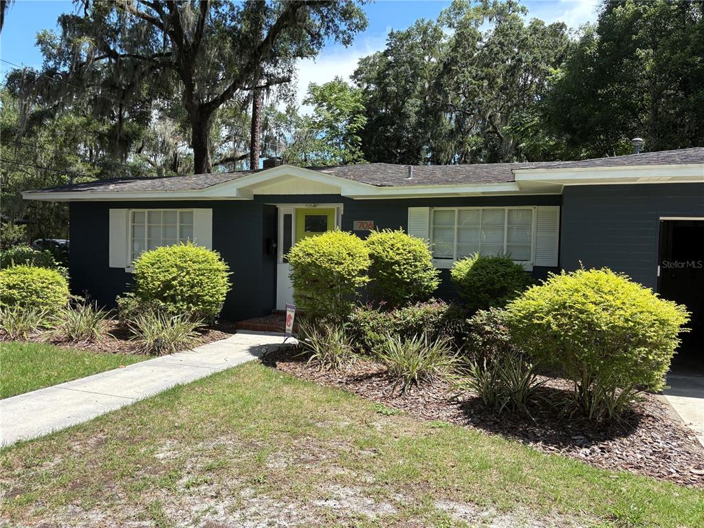 706 Northwest 20th Street Gainesville, FL 32603 - Photo 1 of 46 front view of house with a yard