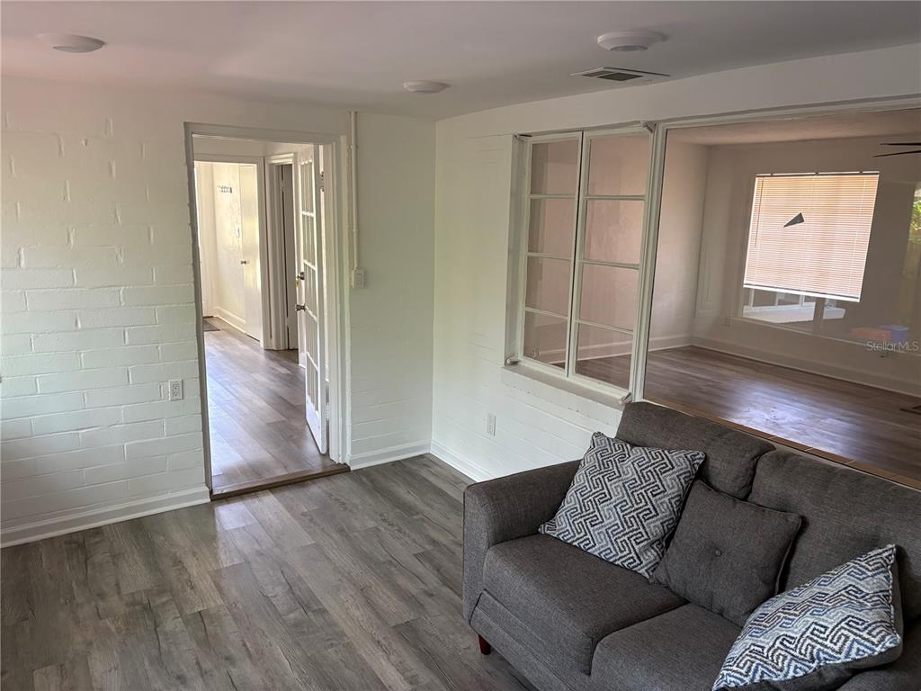 706 Northwest 20th Street Gainesville, FL 32603 - Photo 11 of 46 a living room with furniture and a window