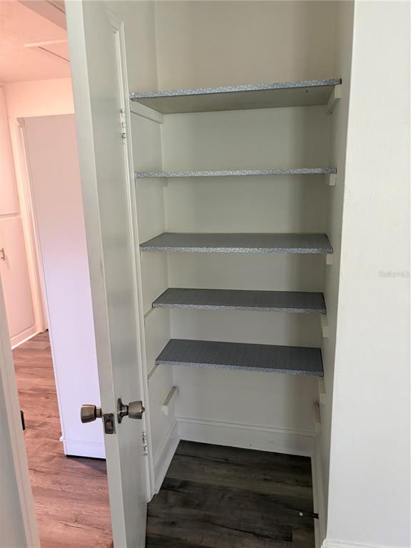 706 Northwest 20th Street Gainesville, FL 32603 - Photo 20 of 46 a view of walk in closet with empty racks