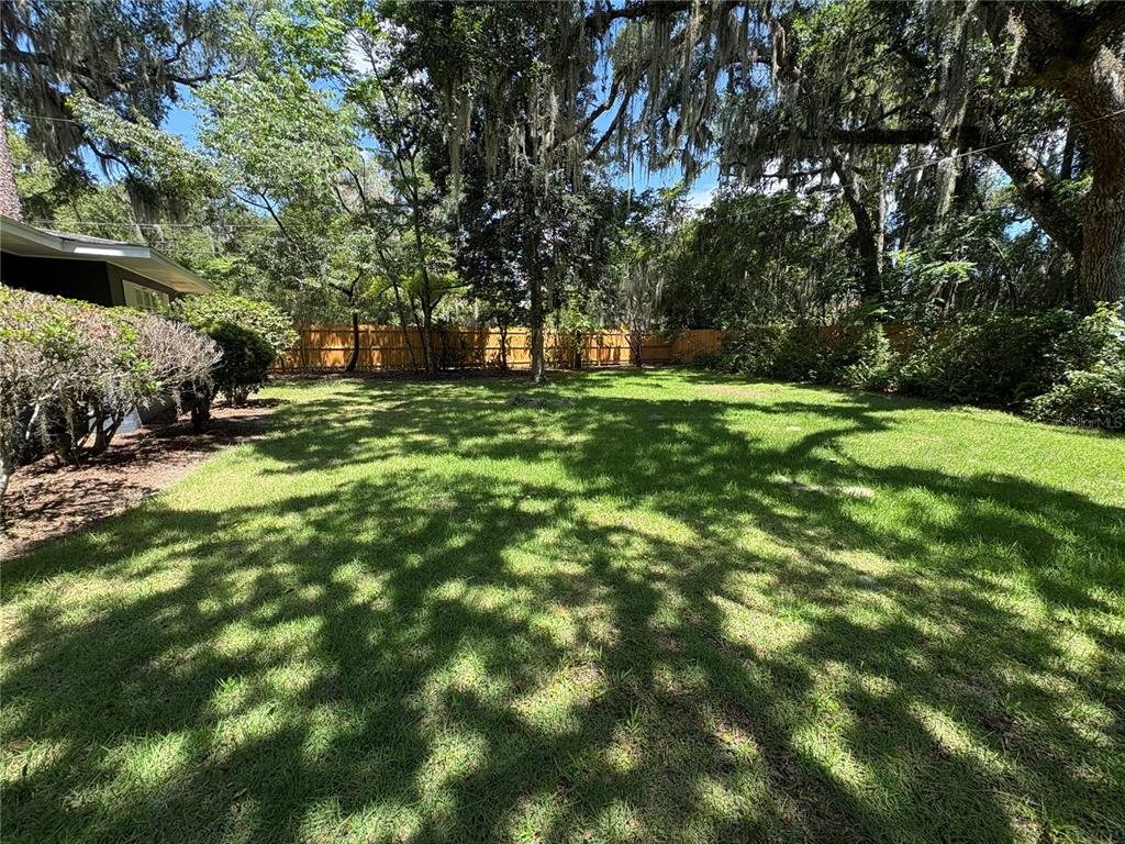 706 Northwest 20th Street Gainesville, FL 32603 - Photo 2 of 46 a view of outdoor space with deck and yard