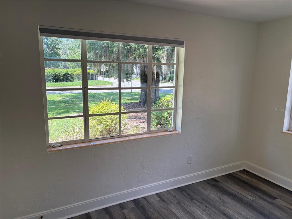 706 Northwest 20th Street Gainesville, FL 32603 - Photo 27 of 46 a view of a room with wooden floor and a window