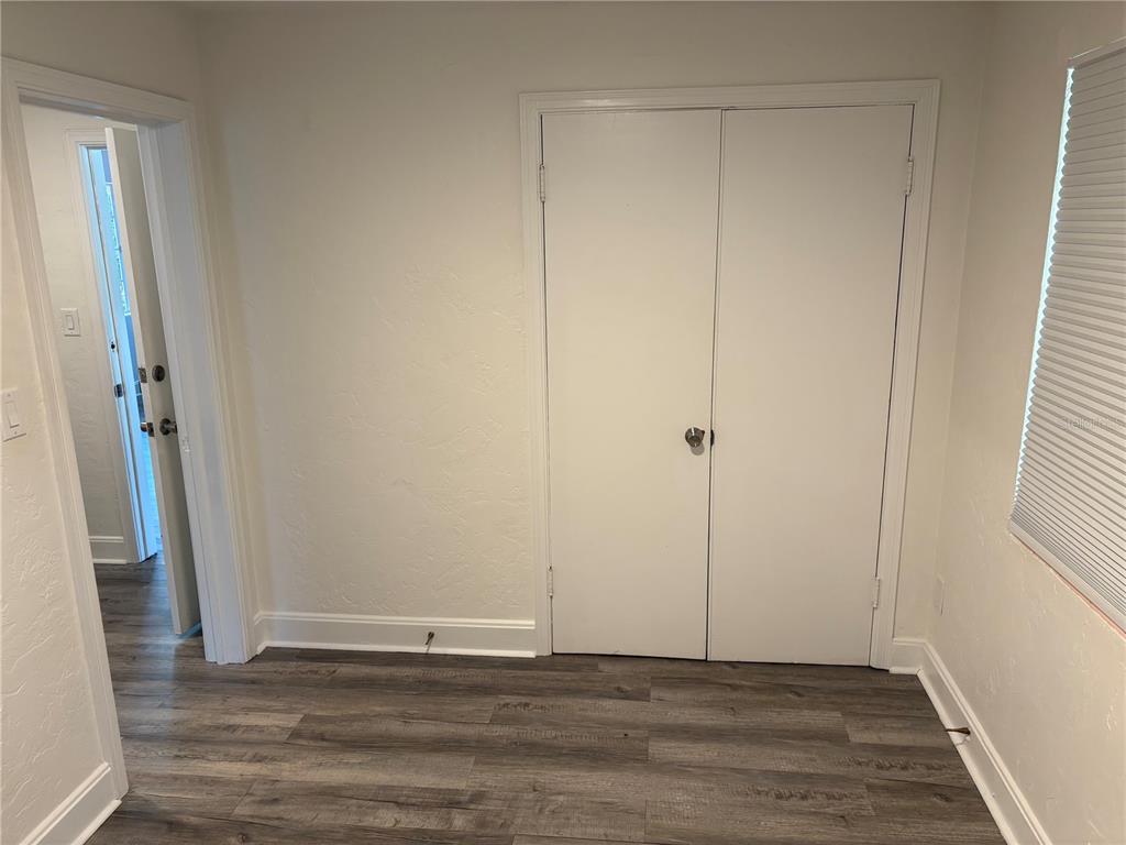 706 Northwest 20th Street Gainesville, FL 32603 - Photo 29 of 46 a view of an empty room with wooden floor