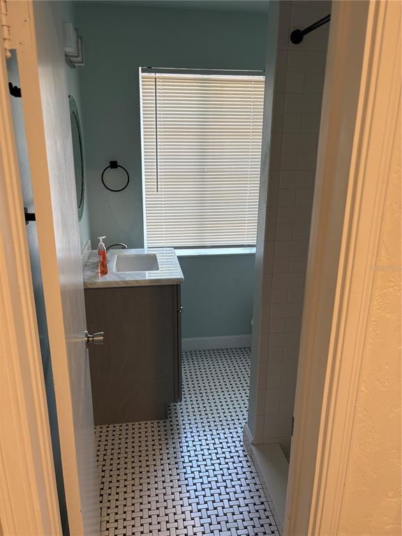 706 Northwest 20th Street Gainesville, FL 32603 - Photo 30 of 46 a bathroom with a sink a toilet and a window