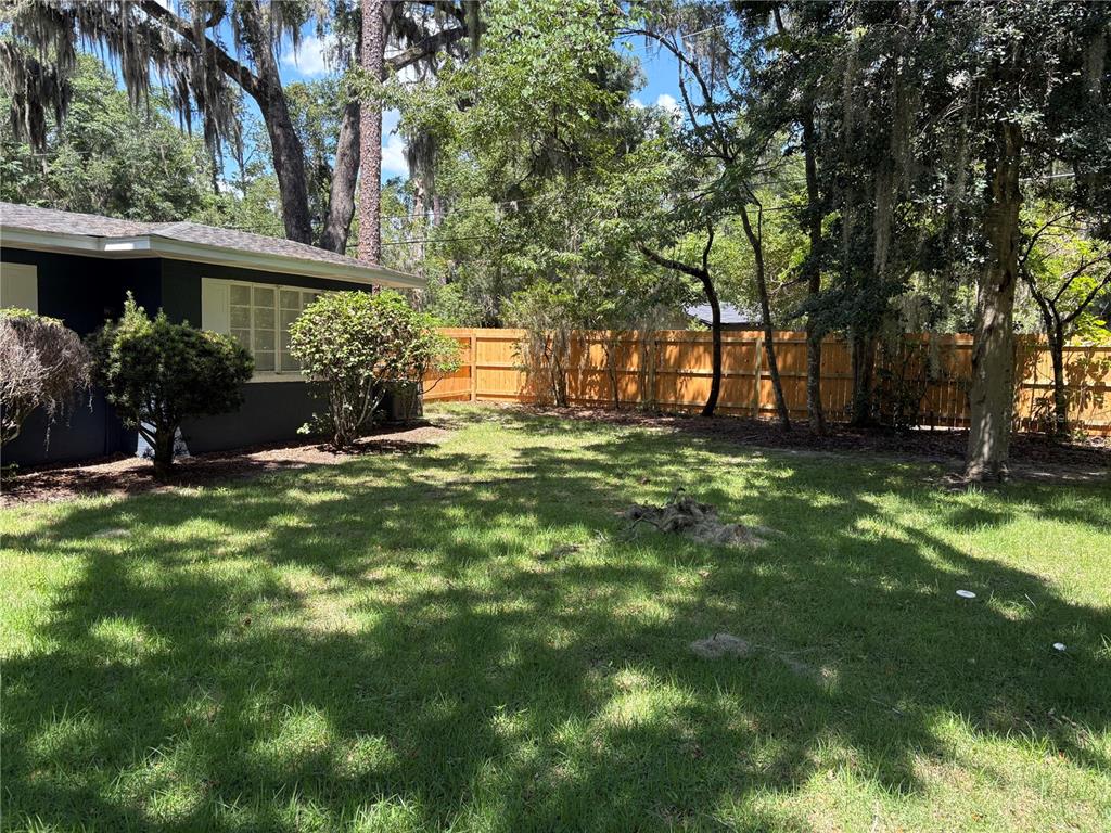 706 Northwest 20th Street Gainesville, FL 32603 - Photo 37 of 46 a view of a house with a yard