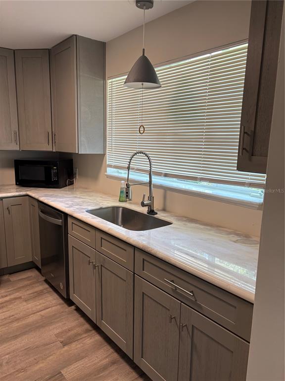706 Northwest 20th Street Gainesville, FL 32603 - Photo 5 of 46 a kitchen with a sink and cabinets