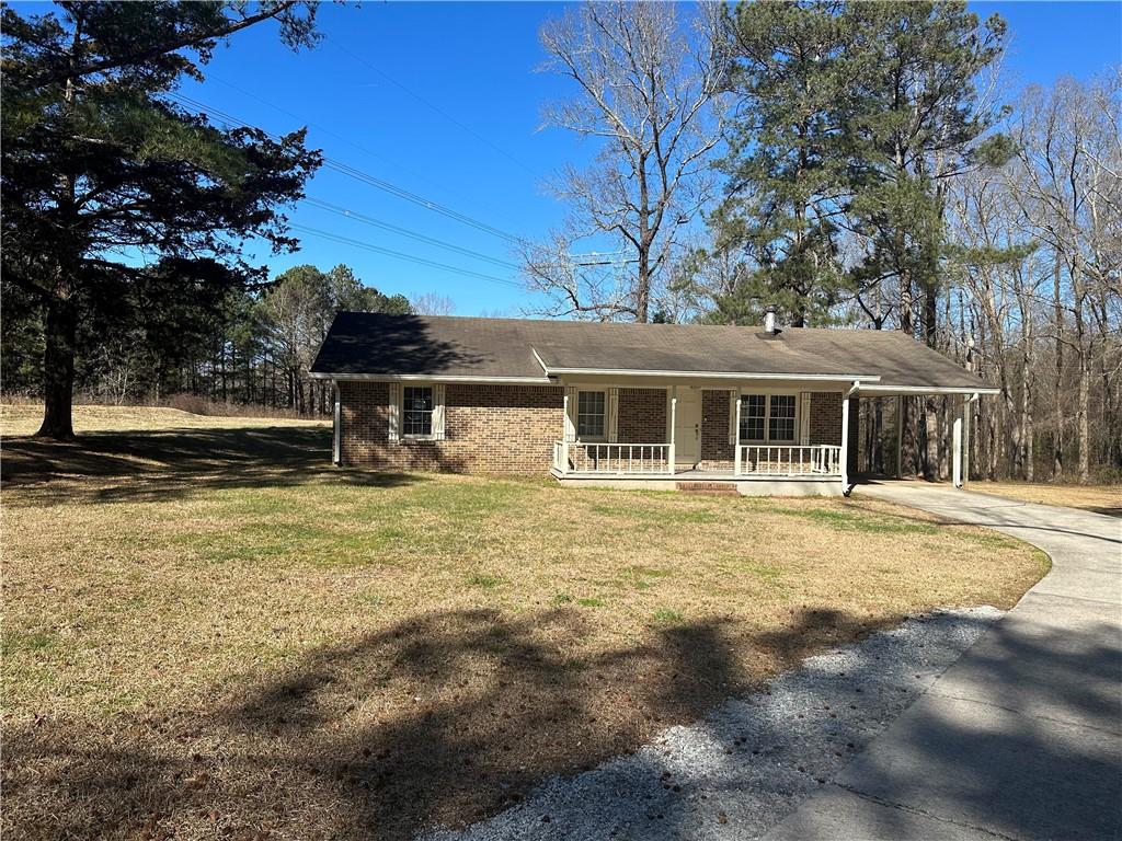 2323 Butler Bridge Road Covington, GA 30016 - Photo 1 of 1 a front view of a house with a yard