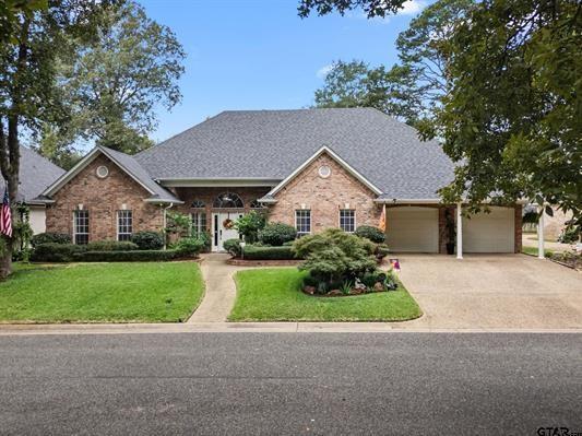 3621 Rock Creek Drive Tyler, TX 75707 - Photo 1 of 29 a front view of a house with a yard