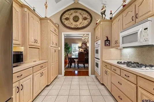 a kitchen with stainless steel appliances a stove and a refrigerator