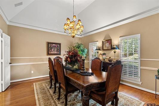 3621 Rock Creek Drive Tyler, TX 75707 - Photo 17 of 29 a view of a dining room with furniture and wooden floor