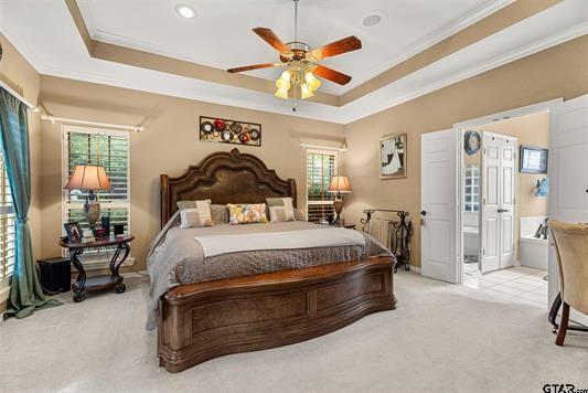3621 Rock Creek Drive Tyler, TX 75707 - Photo 19 of 29 a spacious bedroom with a bed and ceiling fan