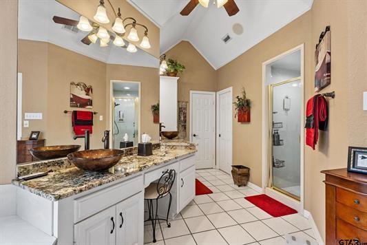 3621 Rock Creek Drive Tyler, TX 75707 - Photo 23 of 29 a living room with granite countertop furniture and a flat screen tv