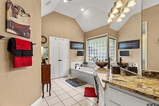3621 Rock Creek Drive Tyler, TX 75707 - Photo 24 of 29 a large living room with stainless steel appliances granite countertop furniture and a large window