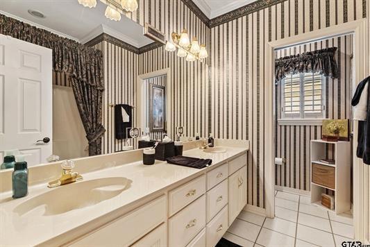 3621 Rock Creek Drive Tyler, TX 75707 - Photo 27 of 29 a bathroom with double vanity sinks a mirror and a shower