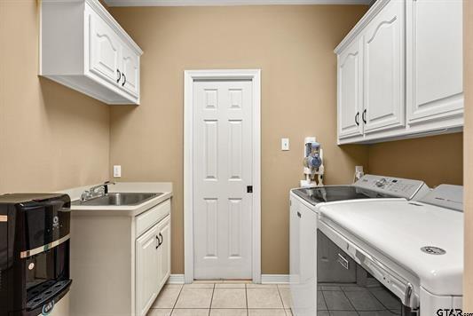 3621 Rock Creek Drive Tyler, TX 75707 - Photo 28 of 29 a utility room with dryer and washer