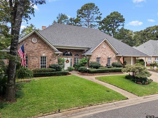 3621 Rock Creek Drive Tyler, TX 75707 - Photo 5 of 29 a front view of a house with a yard and garage
