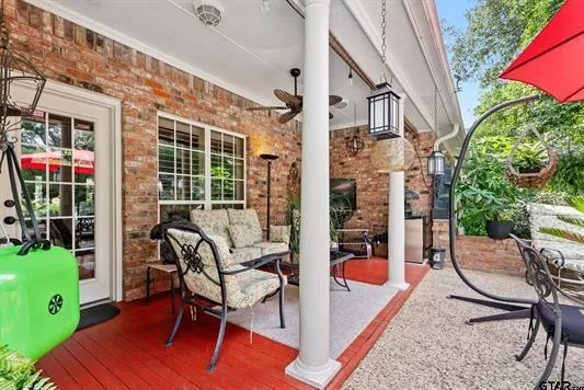 a patio with table and chairs