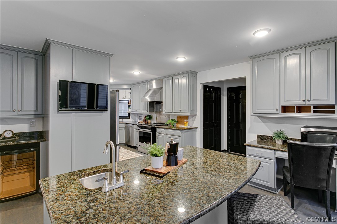 5623 Promontory Pointe Road Midlothian, VA 23112 - Photo 14 of 50 Kitchen with dark stone countertops, wall chimney