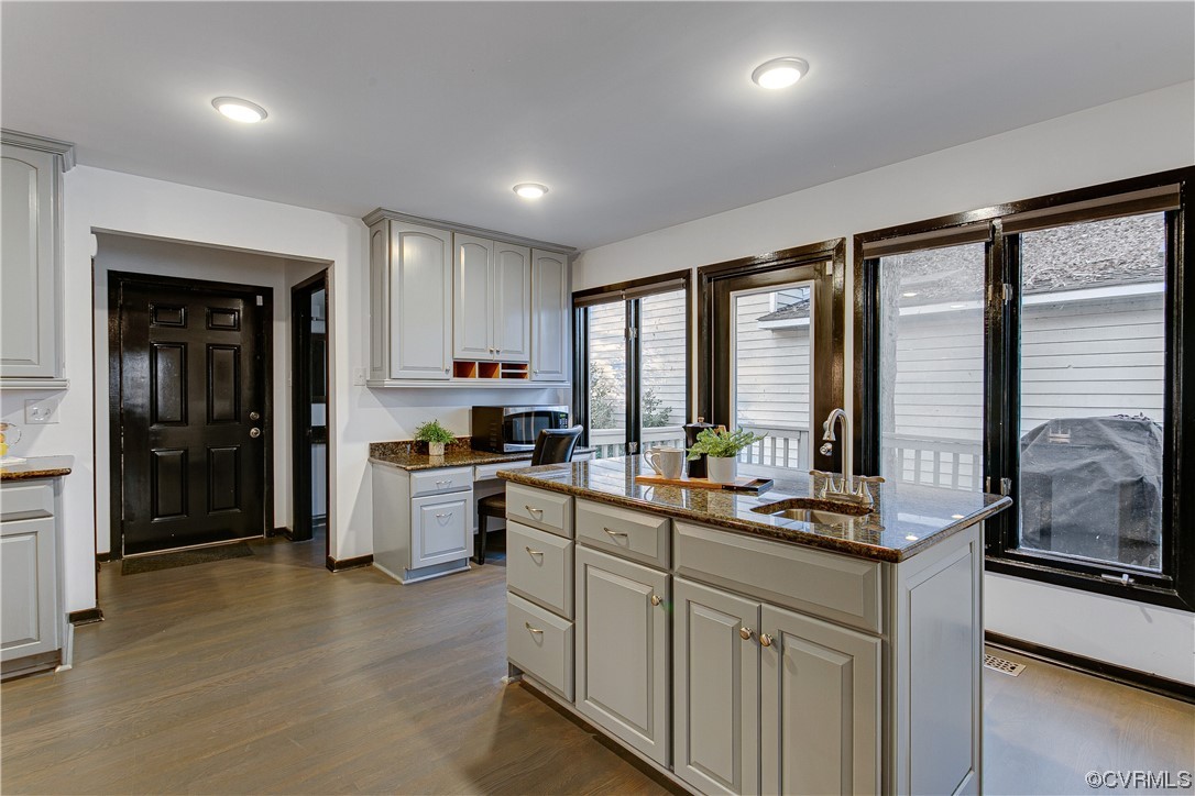 5623 Promontory Pointe Road Midlothian, VA 23112 - Photo 16 of 50 Kitchen with a kitchen island with sink, sink, dar