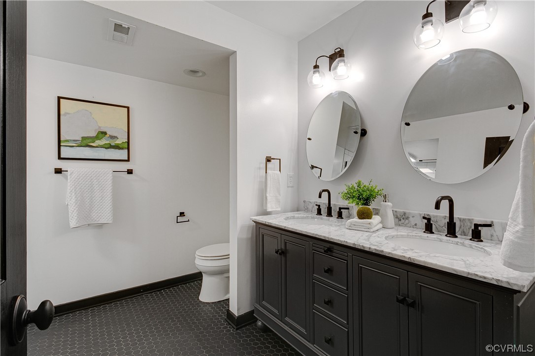 5623 Promontory Pointe Road Midlothian, VA 23112 - Photo 28 of 50 Bathroom featuring double vanity, toilet, and tile