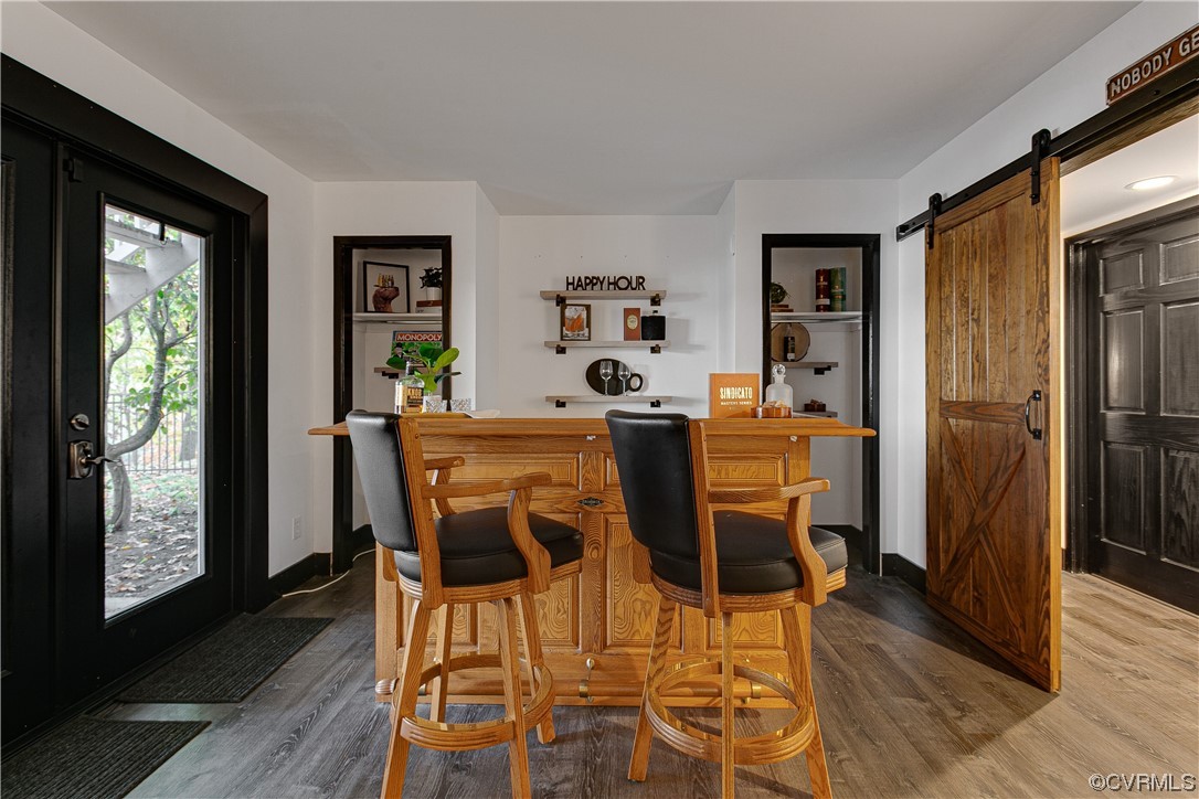 5623 Promontory Pointe Road Midlothian, VA 23112 - Photo 39 of 50 Dining space featuring a barn door and light hardw