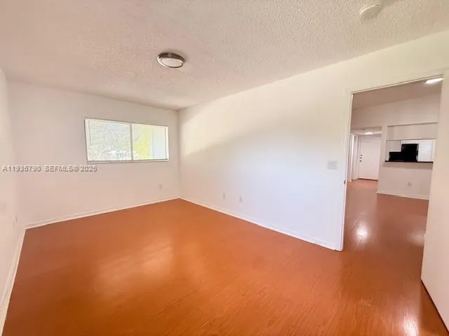 a view of a kitchen with a sink and dishwasher