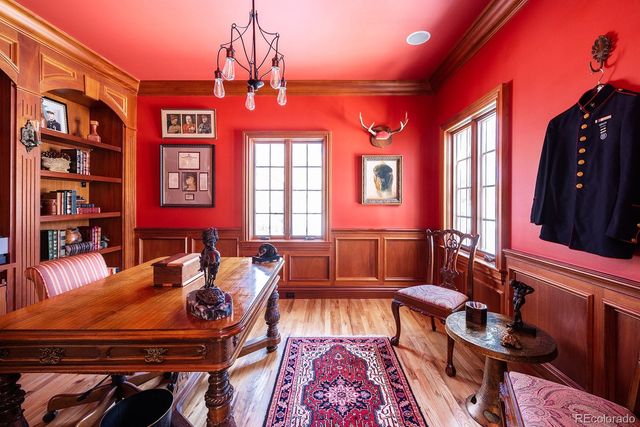 a living room with furniture a rug and a chandelier
